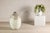 This large artisan ceramic vase features a softly rounded, elongated ovoid silhouette rising to a gently tapered neck. Its...