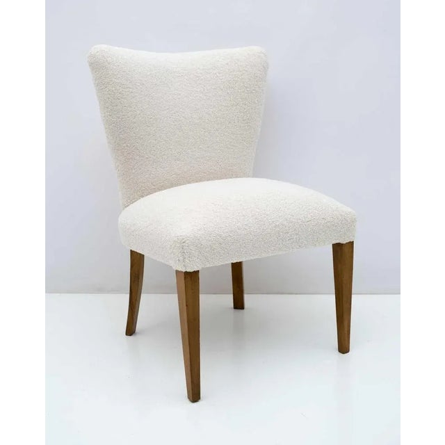 Mid-Century Modern armchair, Italian 1950s production, completely restored and covered in Boucle fabric. It adapts very...