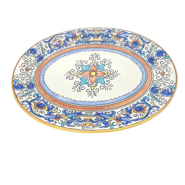 A thing of late afternoon light and hand-touched flourishes, this Portuguese platter bears the Umbria pattern in lush...