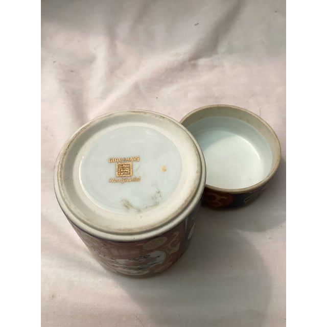 This is a Japanese porcelain Ginger jar known for its cobalt blue and I RON with red decoration, and gold accents. It...