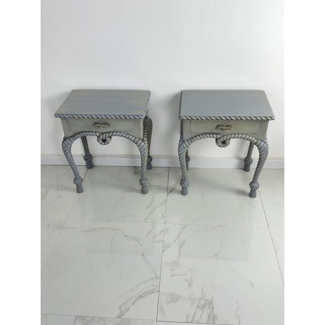 Set of two French Country-style bedside tables with rope details, 1970 Gray in color, featuring sinuous legs and...