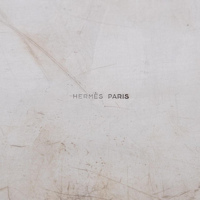 A superb vintage 20th century solid silver cigar box by hermès. The box showcases an engine-turned diagonal pattern on the...