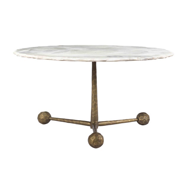 Supported by hand-hammered iron legs, the live-edged white marble top of this artisan-crafted table shows off incredible...