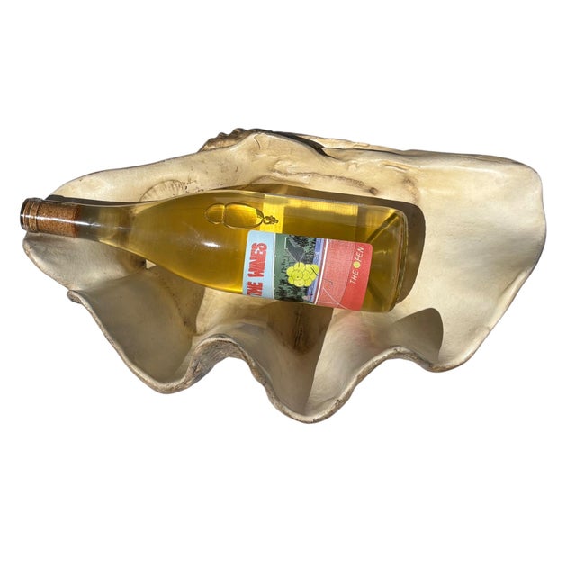 This is an incredibly lifelike decorative reproduction of a Tridaca Gigas giant clam shell; the largest living bivalve...