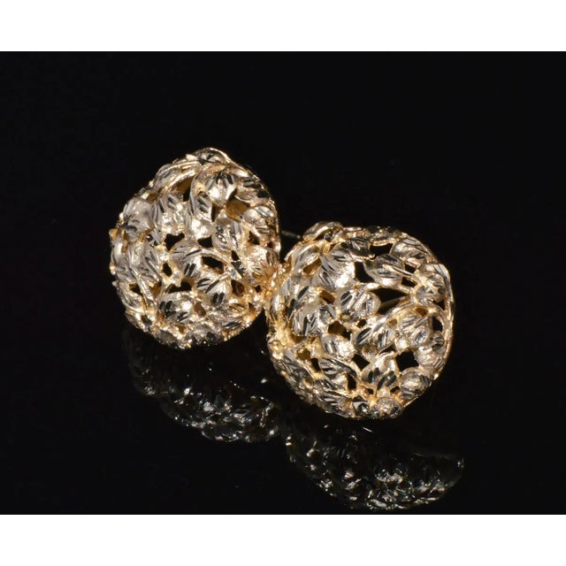 Vintage SAK 14K solid gold cluster cocktail earrings. These earrings feature a stunning cluster leaves design with faceted...