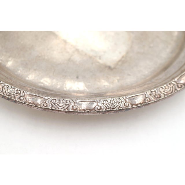 Silver plated Art Deco style round platter. It has dings, bends, and wear from use in the hotel. This item is original to...