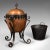 This is an antique Arts and Crafts fireside bin. An English, copper and wrought iron decorative coal or log keeper, dating...