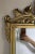 Large polished brass decorative wall mirror in the style of Mastercraft. Rectangular form with finely cast shell motif.