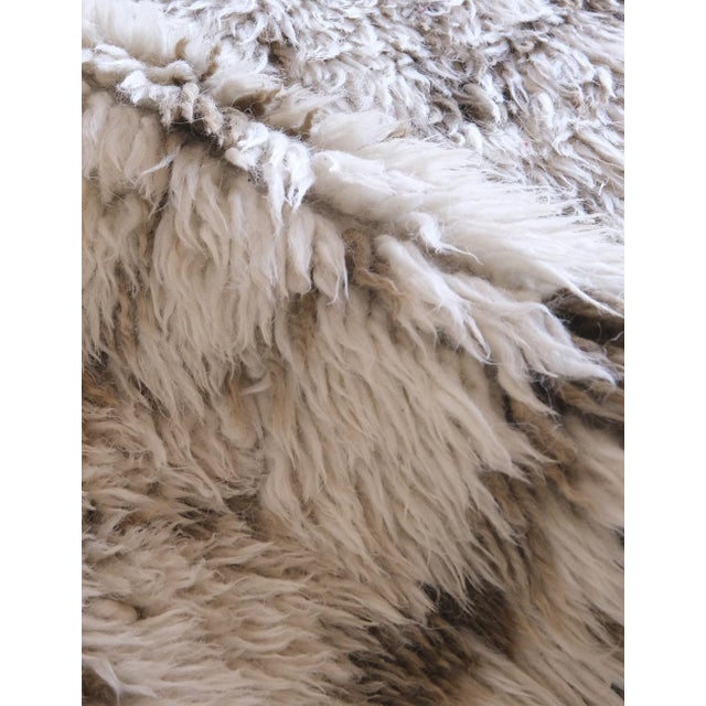 Discover the timeless allure of our 1960's Moroccan Beni Ourain Wool Rug. Hand-knotted by skilled artisans using organic...