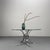 Striking space-age coffee table with chrome-plated frame and round glass top.