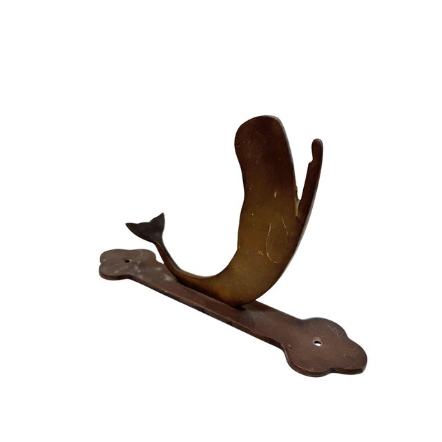 Midcentury solid brass whale wall hook.