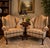 A handsome pair of vintage Queen Anne style wingback club chairs showcasing timeless traditional design and exceptional...
