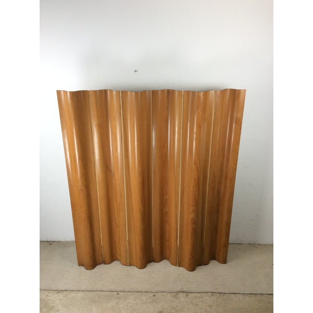 This mid century modern folding screen by Charles Eames for Herman Miller features unique bentwood construction, canvas...