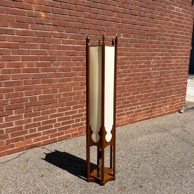 Designed by Arthur Jacobs for Modeline, the hexagonal walnut frame surrounds a softly diffused parchment shade, creating a...