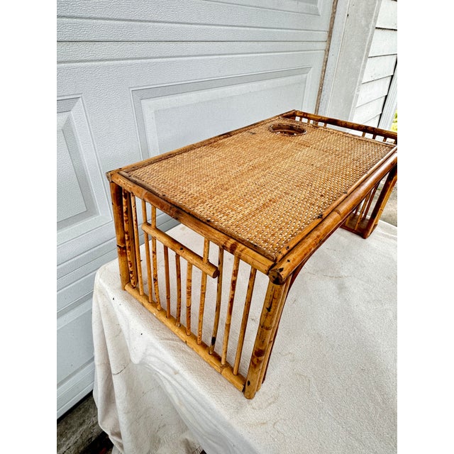 Fantastic vintage bamboo breakfast tray. Features a cup holder and side pocket for reading material. The perfect addition...