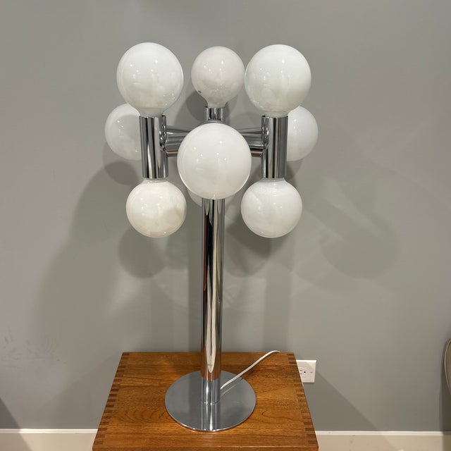 Beautiful Lamp in the Manner of Robert Sonneman. This lamp features a polished metal finish, embodying the timeless...