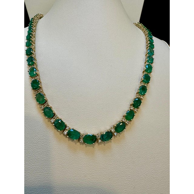 Presenting the exquisite 40 Carat Oval Brazilian Emerald & 3 Carat Diamond Tennis Necklace in 14 Karat Yellow Gold,...
