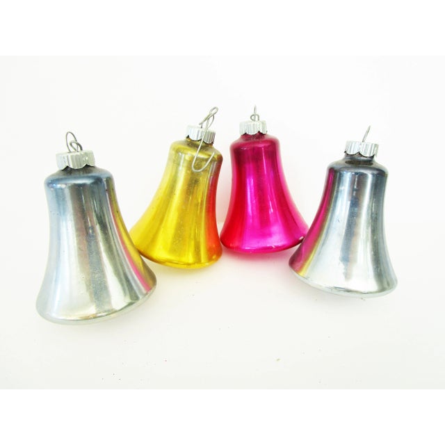 Hand-Blown set of 11 vintage Shiny Brite bell shaped Christmas ornaments in assorted colors. One bell ornament is missing...