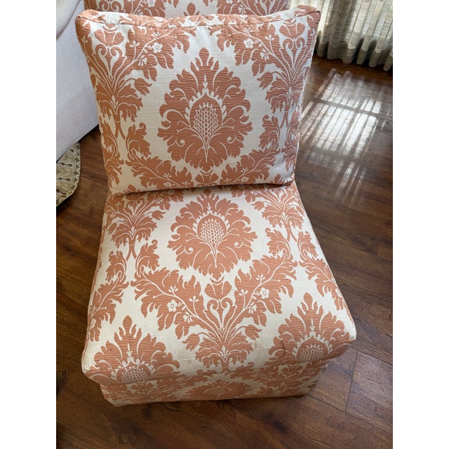 Pair of High Quality Custom Made Skirted Armless Swivel slipper chairs in a Rich Terracotta and Cream Damask Fabric.