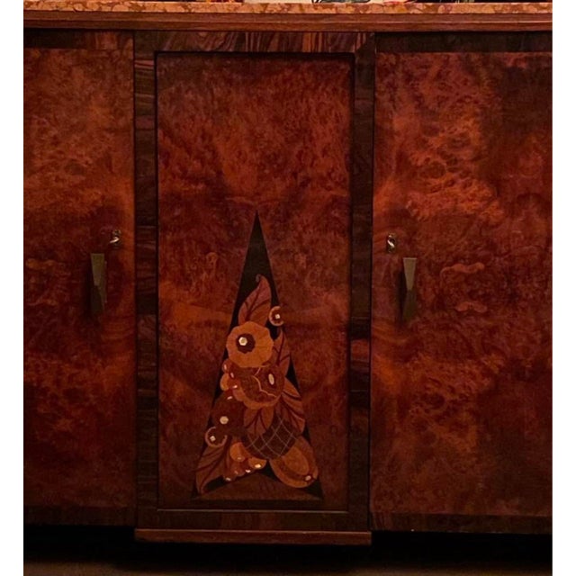 • Date: Circa 1930 • Origin: France • Materials: Burl mahogany, marble top, inlaid central design • Size: ~63” W × 20.5” D...