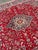 Design Plus Gallery presents a 9ft 6in × 12ft 6in Persian Wool Area Rug. The rug displays a red field with an intricate...