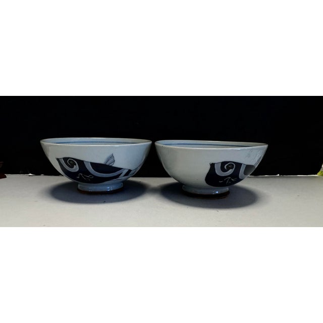 A striking set of two vintage Japanese porcelain bowls by Crane Japan, marked © Ono Pro, featuring a beautifully...