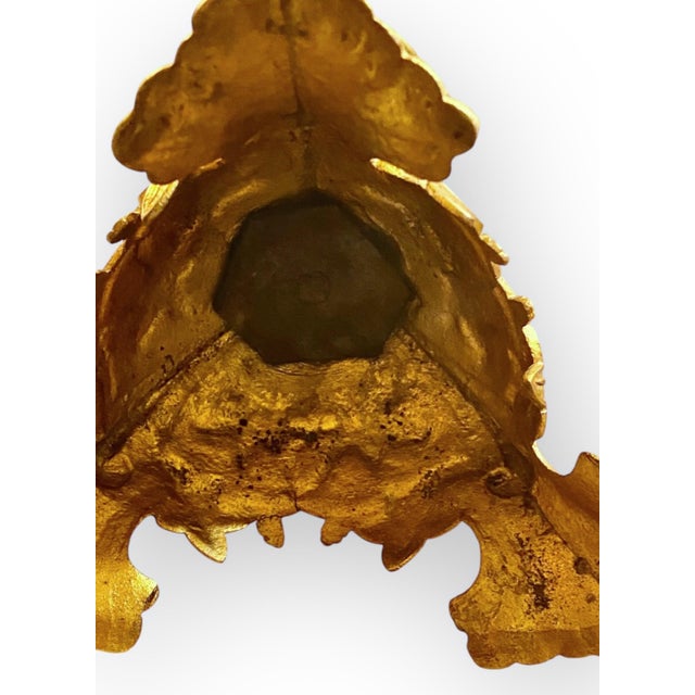 A fine pair of antique 19th century French Art nouveau fire gilded brass alter candlesticks having a style that is ornate,...