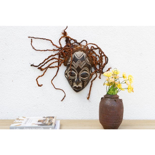 This serene Guro mask from the Ivory Coast is a beautiful example of African tribal art. The mask is characterized by its...