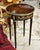 Bring timeless European elegance into your home with this handcrafted round accent side table. Built from durable solid...