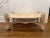 Rare, possibly one of a kind, hand-carved coffee table from a French Estate. Each corner of the coffee table has a carved...
