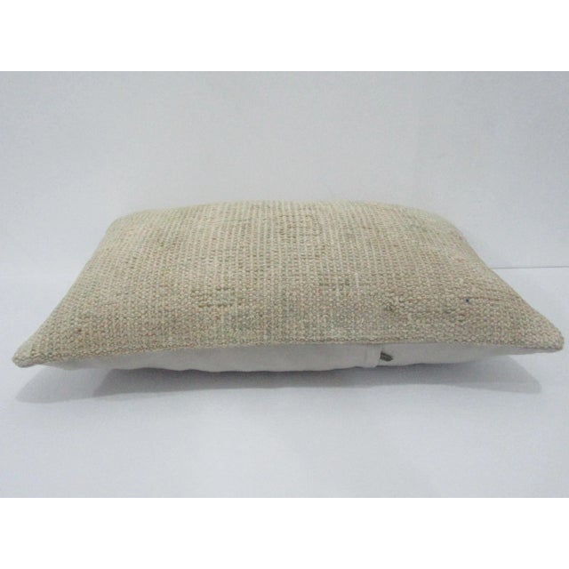 Decorative pillow cover made from a vintage Turkish handknotted rug. Backed with good quality cotton fabric. Pillow...