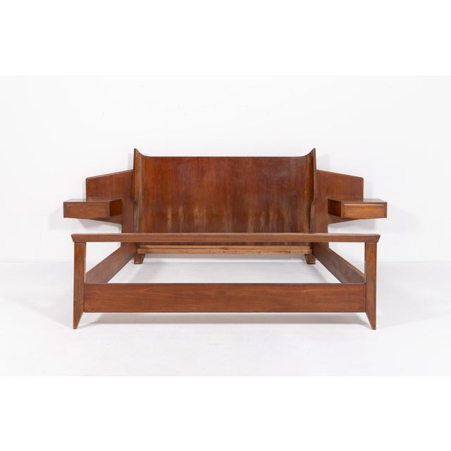 Double bed frame designed by Gio Ponti, Italy 1950’s. The sculptural shape of the headboard and the footboard is...