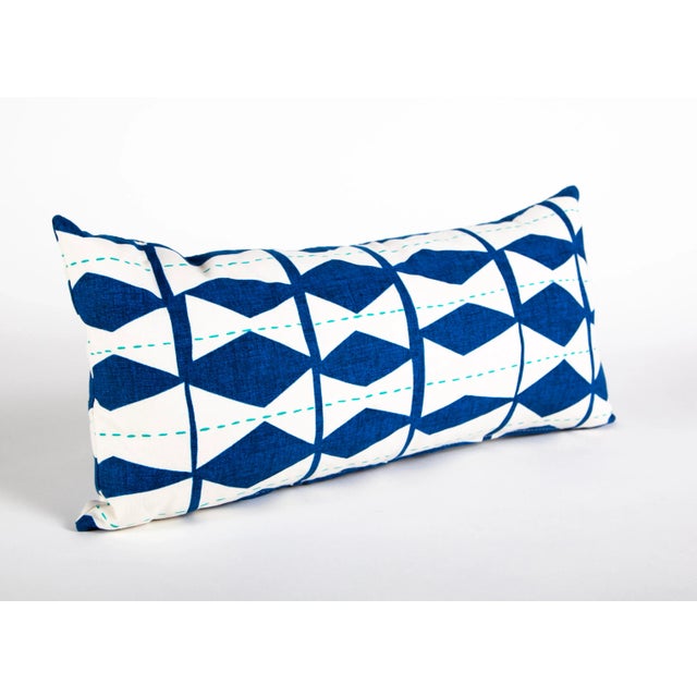 This blue and white lumber pillow measures 12"x24". The whimsical diamond and stripe pattern will make any room of your...
