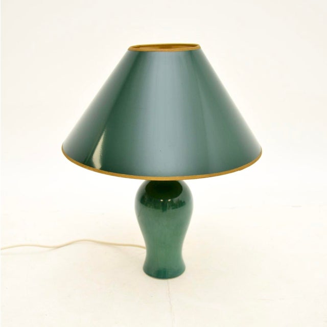 A gorgeous vintage ceramic table lamp, made in England and dating from around the 1970’s. It has a stunning green glaze,...