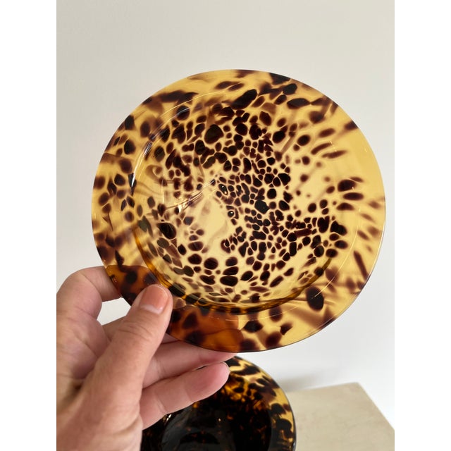 Hand-blown glass rimmed bowl in a tortoise shell motif/leopard print in like new condition. Each bowl is unique, with a...