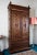 A narrow two-door wardrobe made of solid oak wood, originating from Brittany, France, from the turn of the 19th and 20th...