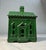 The Antique 1927 cast iron house shaped still bank by Andy & Susan Moore is a unique and original collectible piece...