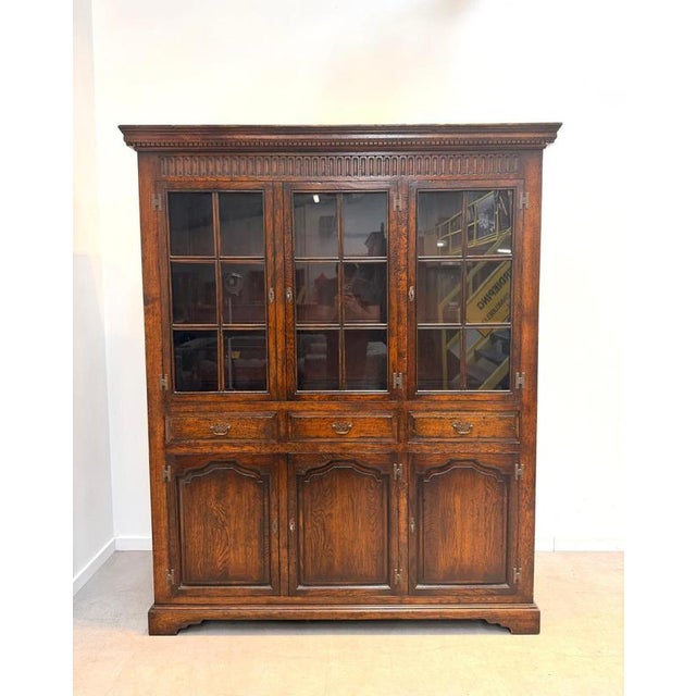 Impressive antique oak display and storage cabinet, crafted in solid oak with a beautifully aged warm patina. The upper...