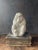Stunning sculpture , all in a crisp white glaze, of a snow monkey sitting. Very sculpted and textured appeal. Lovely art...