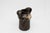 This large, two-handled ceramic vase impresses with its typical organic shape and a matte brown flowing glaze. It comes...