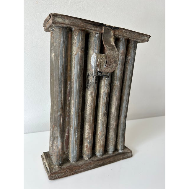 Primitive antique tin 12 candle mold with handle. Sculptural piece, rustic farmhouse decor. Candle mold makes slightly...