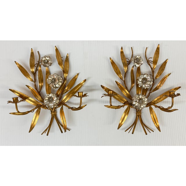 Design Plus Gallery presents a Pair of Italian Regency Wall Sconces. The sconces are vintage, made of metal with the use...
