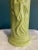 A striking vintage ceramic vase featuring a beautifully modeled relief image of an Asian woman dressed in flowing robes....
