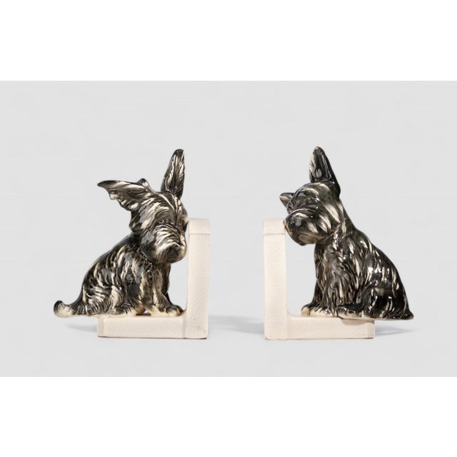 Pair of french Art Déco painted ceramic bookends shaped like Scotch Terrier dogs By: unknown Material: ceramic, enamel,...
