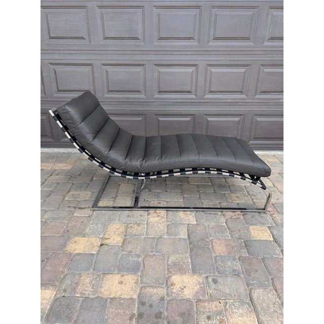 Acme Chaise Lounge Chair - Modern Black Leather with Chrome Frame Sleek mid-century modern style chaise lounge by Acme...