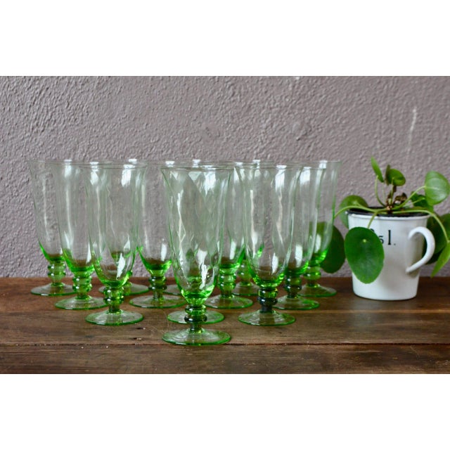 A beautiful handcrafted work signs this series of antique glasses. With a colored foot and a faceted spiral body, these...