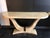 Solid wood console table covered in faux parchment, 1970s, in the style of Karl Springer. USA. Circa 1970. The legs are...