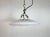 Industrial white enamel factory pendant light made in United Kingdom during the 1960s. White enamel inside the shade....