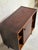 Beautiful vintage Danish mid century cabinet crafted in richly grained rosewood veneer with elegant tapered legs and...
