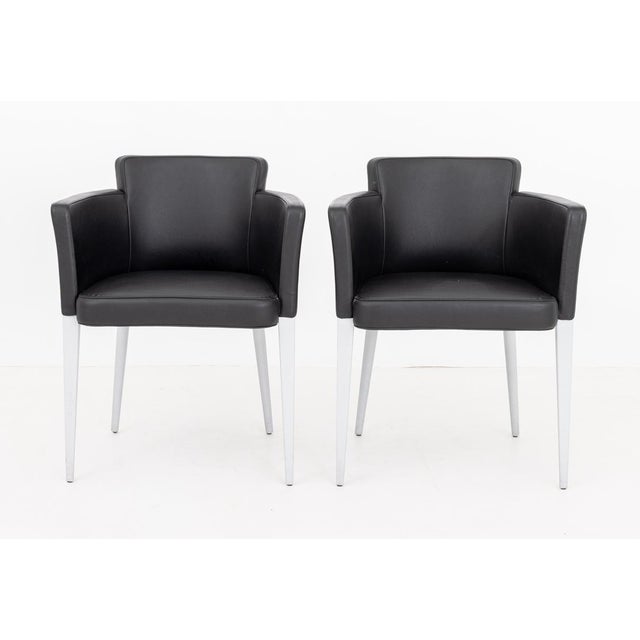 Pair of Cassina Ariane Black Leather Upholstered Club Chairs, labels to undersides. 28.5" H x 22" W x 19" D; seat: 18.5"...